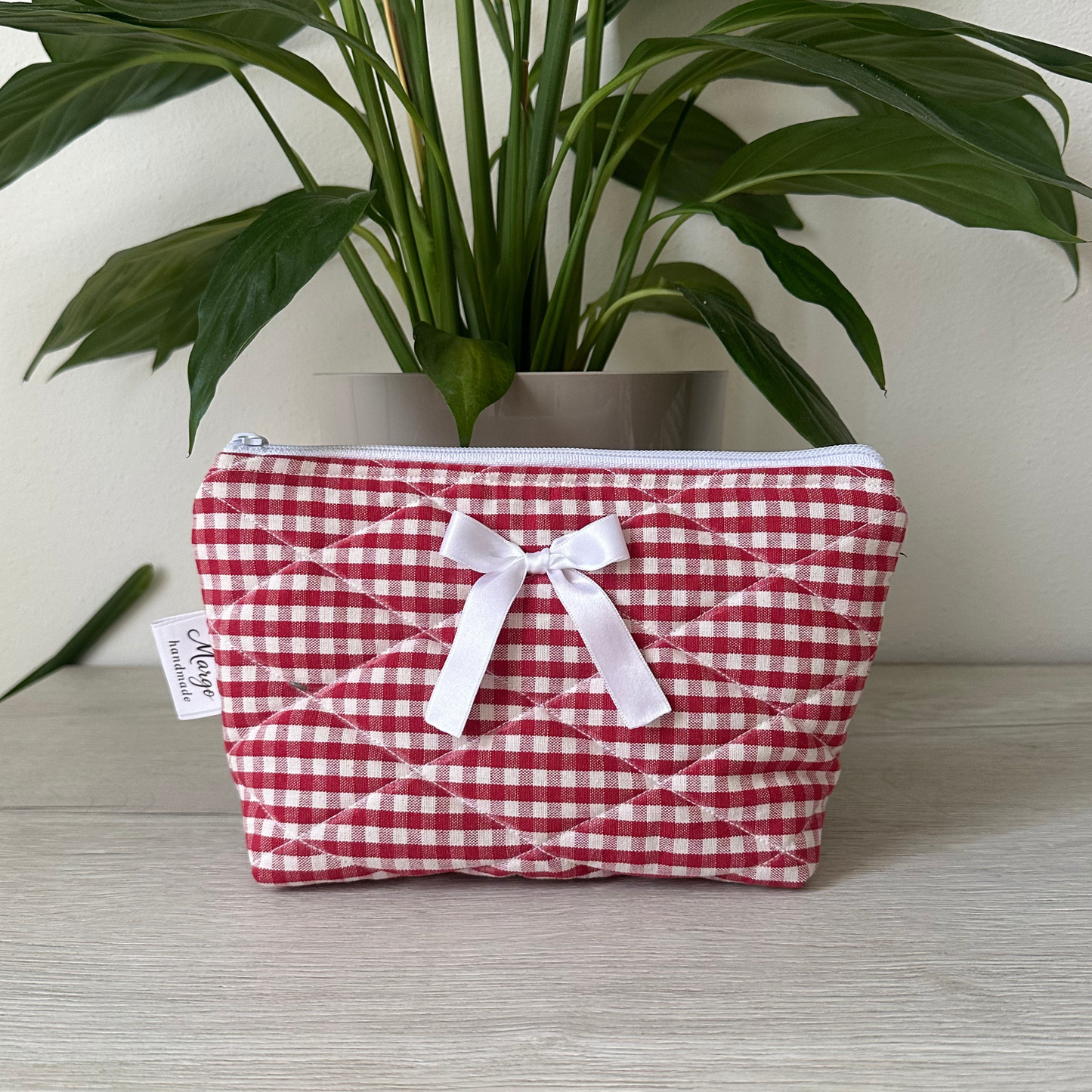 Pochette a quadretti con fiocco