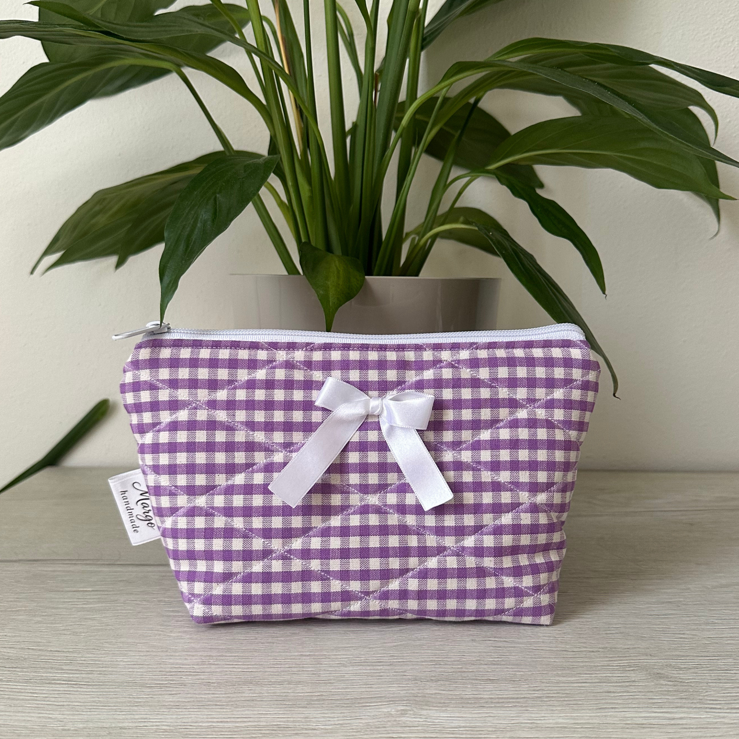 Pochette a quadretti con fiocco