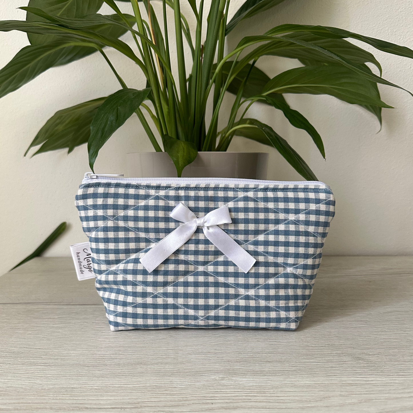 Pochette a quadretti con fiocco