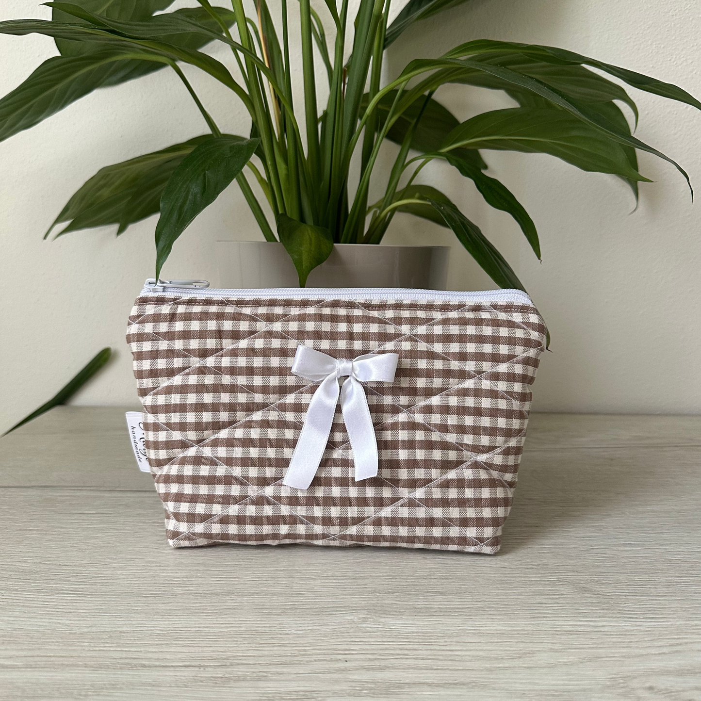 Pochette a quadretti con fiocco